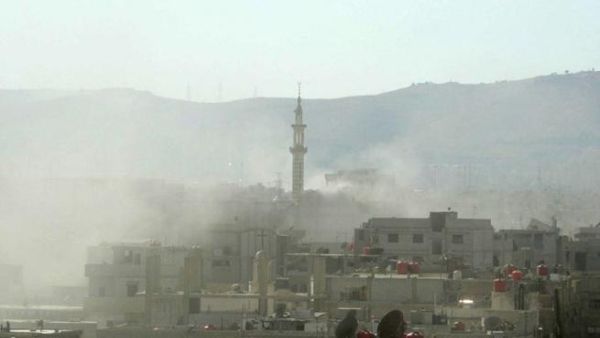 A handout image released by the Syrian opposition's Shaam News Network shows smoke above buildings following what Syrian rebels claim to be a toxic gas attack by pro-government forces in eastern Ghouta, on the outskirts of Damascus on August 21, 2013. "AFP PHOTO / HO / SHAAM NEWS NETWORK" 