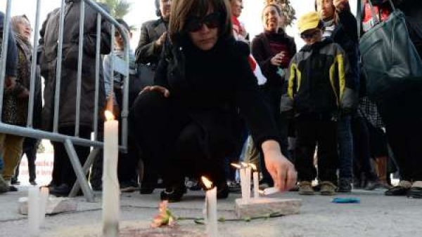 People place candles outside Tunis' National Bardo Museum after an attacked that claimed 22 lives.  (AFP/Fadel Senna)