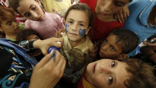 Children in the northern Gaza Strip town of Jabalia attend a UN-sponsored mental health program in August 2014 to cope with trauma sparked by war.  (AFP/Mohammed Abed)