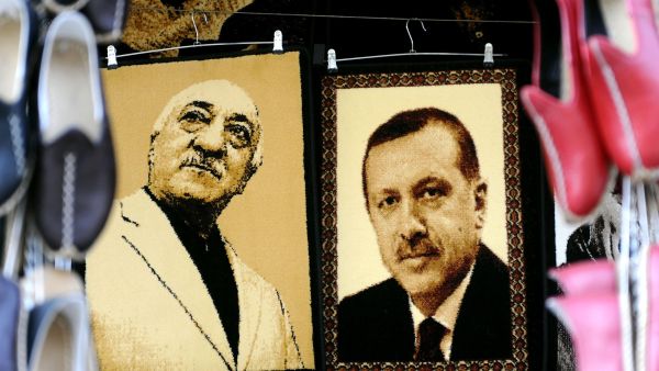 A market in Gaziantep, Turkey displays embroidered images of US-based Turkish preacher Fethullah Gulen (left) and President Recep Tayyip Erdogan (right).  (AFP/Ozan Kose)