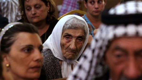 Christians gather for a church service in Iraq.  While in previous years Iraq's diverse ethnic and religious groups largely coexisted, recent conflicts have worked to divide Iraqis along stark sectarian lines. (AFP/File)