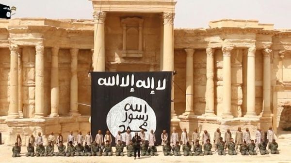 This video screenshot shows a mass public execution of several dozen Syrian government soldiers in the ancient Roman theater of Syria's Palmyra, most likely soon after Daesh's May 21 takeover of the city.  (AFP/File)