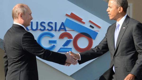 Russia’s President Vladimir Putin welcomes US President Barack Obama at the start of the G20 summit on September 5, 2013 in Saint Petersburg. (AFP)