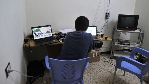 A young Syrian man works on his laptop in Aleppo.  (AFP/Tauseef Mustafa)