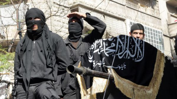 Members of jihadist group Al-Nusra Front take part in a parade calling for the establishment of an Islamic state in Syria. (Image credit: AFP)