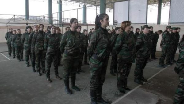 وحده نسائية من القوات السورية الوطنية،قوات مدنية شكلها النظام السوري لدعم الجيش النظامي/أ.ف.ب