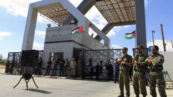Members of Hamas' security forces stand guard in front of the Rafah border crossing in the southern Gaza Strip on September 16, 2013. [Said Khatib/Getty Images]