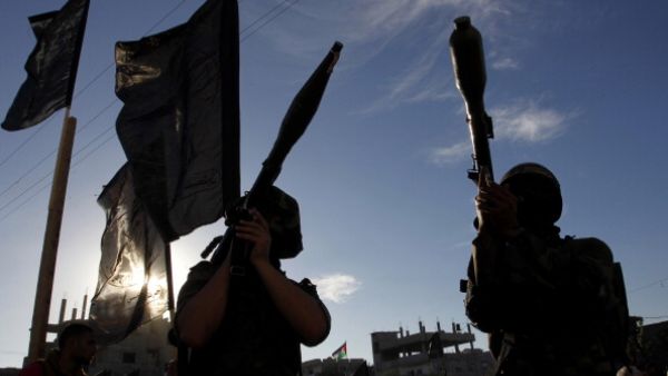Palestinian militants of the Islamic Jihad hold rocket propelled grenades (RPG) as they take part in a rally against Israel in the southern Gaza Strip town of Rafah, on October 24, 2013. [Photo credit: SAID KHATIB/AFP/Getty Images]