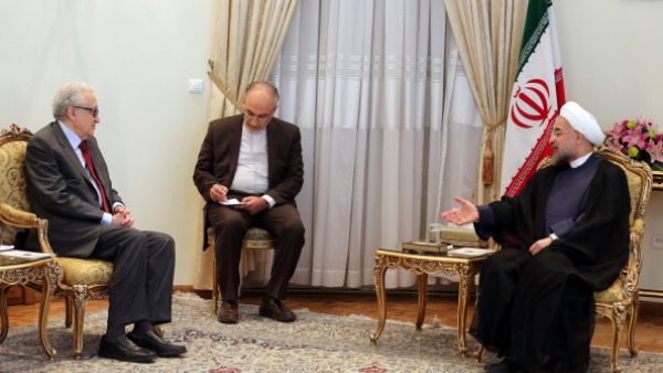 Iranian President Hassan Rouhani  meets with International Peace envoy to Syria Lakhdar Brahimi  in Tehran on October 27, 2013.  [ATTA KENARE/AFP/Getty Images]