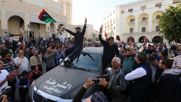 attend a demonstration alongside Libyan civilians in Tripoli against the presence of militia in the capital and in support of the army and police on November 19, 2013. [MAHMUD TURKIA/Getty Images]
