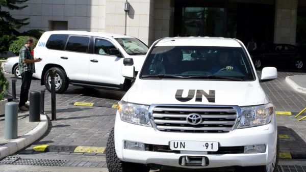 A convoy of United Nations vehicles carrying chemical weapons experts, leaves a hotel in the Syrian capital Damascus. [AFP]
