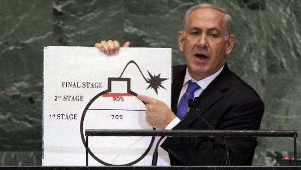 Benjamin Netanyahu shows an illustration as he describes his concerns over Iran's nuclear ambitions during his address to the 67th session of the United Nations General Assembly last September. [AP]