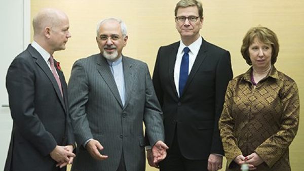 William Hague, Iranian foreign minister Mohammad Javad Zarif, Germany's foreign minister Guido Westerwelle and EU foreign affairs chief Catherine Ashton at the talks in Geneva. [Jean-Christophe Bott/AP]
