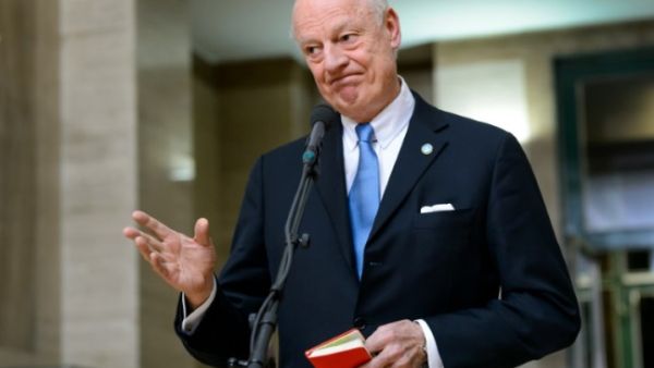 UN envoy for Syria Staffan de Mistura gestures as he speaks to journalists during ongoing peace talks at the UN offices in Geneva on January 29, 2016. (AFP / Fabrice Coffrini)