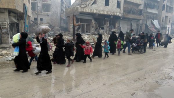 Aleppo residents flee their homes (Stringer/AFP)