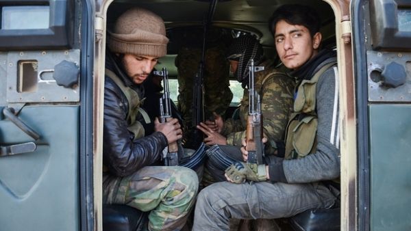 Rebel fighters near the town of Bizaah, northeast of the city of al-Bab on 4 February. (AFP/File) Rebel fighters near the town of Bizaah, northeast of the city of al-Bab on 4 February. (AFP/File)