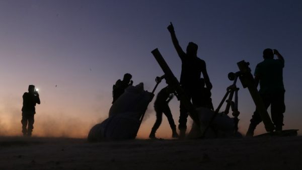 Fighters from the Free Syrian Army cheer and react as they fight against the Islamic State (IS) group jihadists on the outskirts of the northern Syrian town of Dabiq, on October 15, 2016. (AFP/Nazeer al-Khatib)