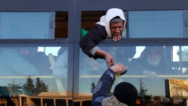 Syrians, who were evacuated from rebel-held neighborhoods in the embattled city of Aleppo, arrive in the opposition-controlled Khan al-Aassal region, west of the city, on December 15, 2016. (AFP/Baraa al-Halabi)