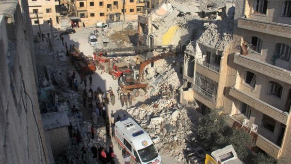 Syrian Civil Defence members search on May 31, 2016 for survivors amid the rubble following reported Russian air strikes the previous night on the Syrian northwestern city of Idlib. (AFP/Omar Haj Kadour)