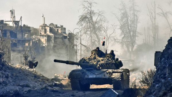 Syrian pro-government forces maneuver a tank in the newly retaken area of Sahat al-Melh and Qasr al-Adly in Aleppo's Old City on December 8, 2016. (AFP/George Ourfalian)