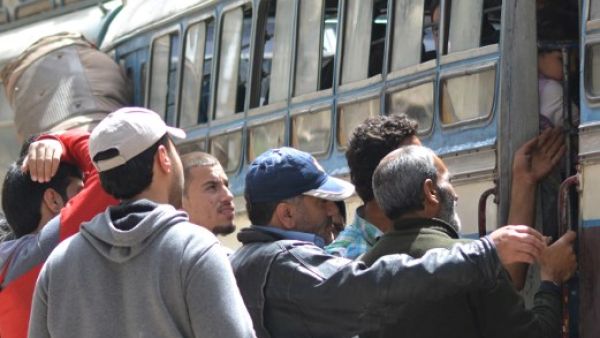 Evacuees board buses with their belongings on top as Syrian rebels and their families were being evacuated from the town of Yalda on the outskirts of Damascus. (AFP/ File Photo)
