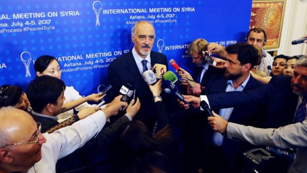 Syrian chief negotiator and Ambassador of the Permanent Representative Mission of Syria to the United Nations Bashar al-Jaafari (C) speaks to the press during a fifth round of Syria peace talks on July 5, 2017, in Astana. (Stanislav Filippov/AFP)