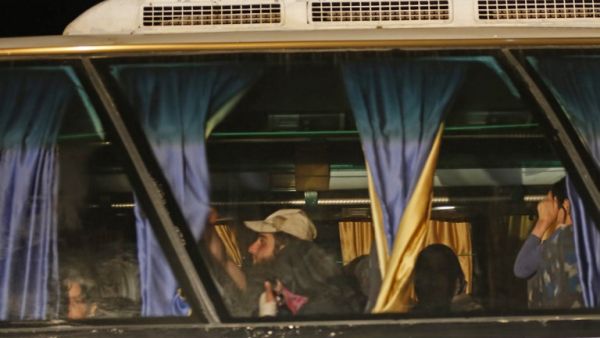 Members of ISIS and their families are transported from the Lebanese border to eastern Syria (Louai Beshara/AFP)