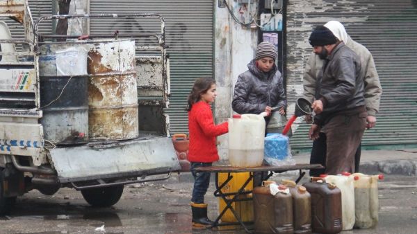 View photos
Residents buy petrol on a street in the northwestern Syrian city of Idlib on December 30, 2016 as a truce brokered by Russia and Turkey came into effect. (AFP/Omar haj kadour)
