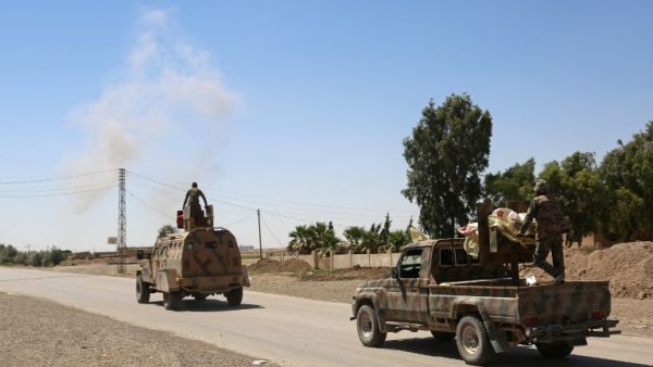 Syrian Democratic Forces (SDF) on the outskirts of Raqa, June 7, 2017, two days after finally entering the northern city. (Delil Souleiman/AFP)