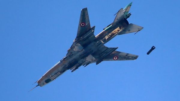 A Syrian Sukhoi Su-22 figther drops a bomb on the rebel-held area of Damascus' Jobar district on June 30, 2017. (Amer Almohibany/AFP)