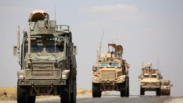 US-made armoured vehicles are seen on a road near the northern Syrian village of Ain Issa on June 3, 2017. (Delil Souleiman/AFP)