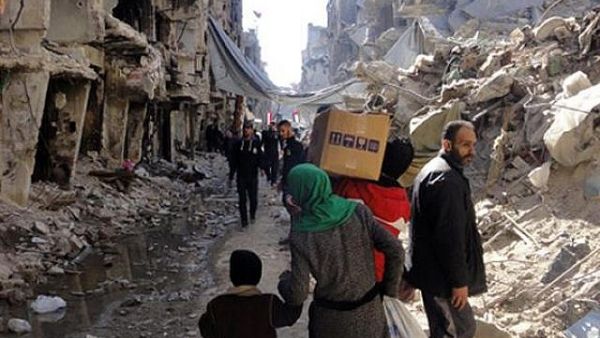 Residents of Syria's besieged Yarmouk refugee camp. (UNRWA/AFP)