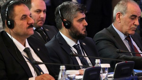 Chief opposition negotiator Mohammad Alloush (C) of the Jaish al-Islam looks on during the second session of Syria peace talks at the Rixos President Hotel in Astana, on February 16, 2017. (AFP/Stanislav Filippov)