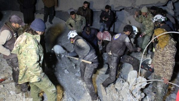 Syrian civil defense volunteers, known as the White Helmets, dig through the rubble of a mosque following an airstrike on a mosque in the village of Al-Jineh near Aleppo late on March 16, 2017. (AFP/Omar Haj Kadour)