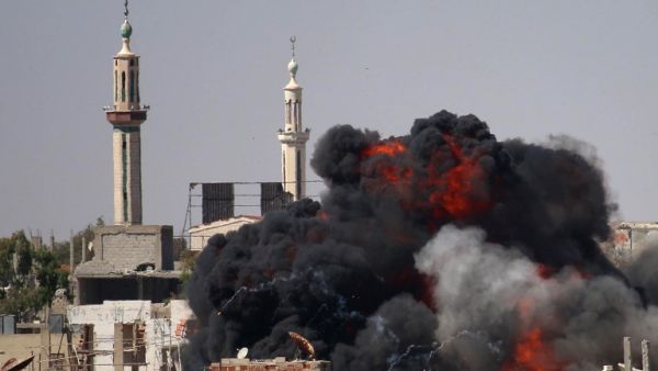 A ball of fire rises from a building following a reported air strike by Syrian government forces on a rebel-held area in the southern city of Daraa, on June 11, 2017. (Mohamad Abazeed/AFP)