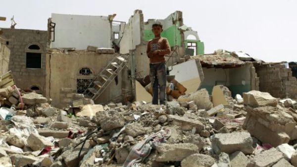 A Yemeni child walks through the rubble of a building hit by a Saudi airstrike. (AFP/File)