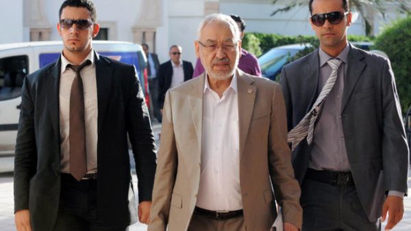 Tunisia's ruling Islamist Ennahda party's leader Rached Ghannouchi (C) arrives for a meeting as part of talks with the opposition. (Image credit: AFP)
