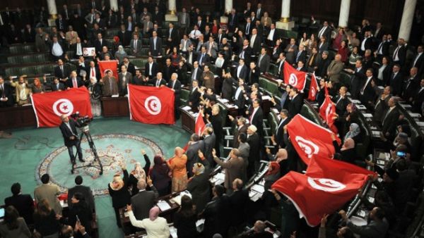 Critics of the new law voiced concerns over putting customized conditions that fit specific parties who may exploit the country's difficult economic situation. (AFP/File)