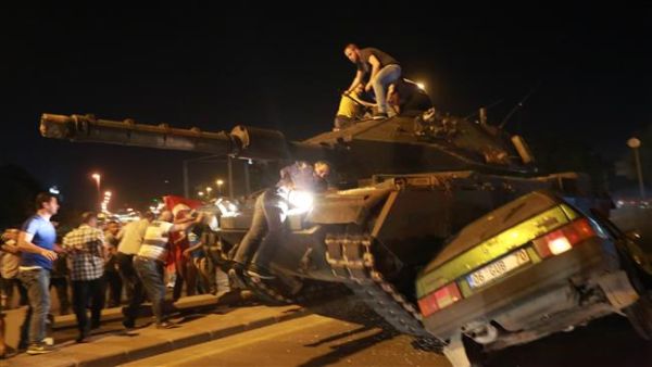 A tanks drives over a car during the failed coup attempt in Ankara. (AFP/File)