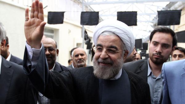 Hassan Rowhani, a moderate Iranian presidential candidate and former top nuclear negotiator, waves as he arrives for to campaign at the Jamaran mosque in Tehran (Atta Kanare/ AFP)