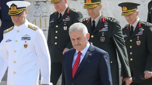 Turkey's Prime Minister Binali Yildirim (C) and members of Turkish Supreme Military Council (YAS) are seen during their visit at Anitkabir, mausoleum of Mustafa Kemal Ataturk in Ankara, on July 28, 2016. (AFP/Adem Altan)