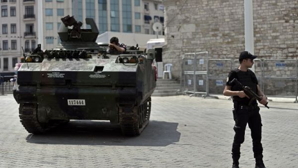A police officer stands next to an armored vehicle that was used by soldiers during the coup attempt at Taksim square in Istanbul on July 17, 2016. (AFP/Aris Messinis) A police officer stands next to an armored vehicle that was used by soldiers during the coup attempt at Taksim square in Istanbul on July 17, 2016. (AFP/Aris Messinis)