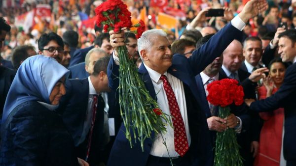 Turkey's Minister of Transport, Maritime and Communication and new chairman candidate for ruling AK Party Binali Yildirim greets supporters as he arrives with his wife Semiha Yildirim for the second extraordinary congress of the AK Party in Ankara, on May 22, 2016. (AFP/Adem Altan) Turkey's Minister of Transport, Maritime and Communication and new chairman candidate for ruling AK Party Binali Yildirim greets supporters as he arrives with his wife Semiha Yildirim for the second extraordinary congress of the AK Party in Ankara, on May 22, 2016. (AFP/Adem Altan)