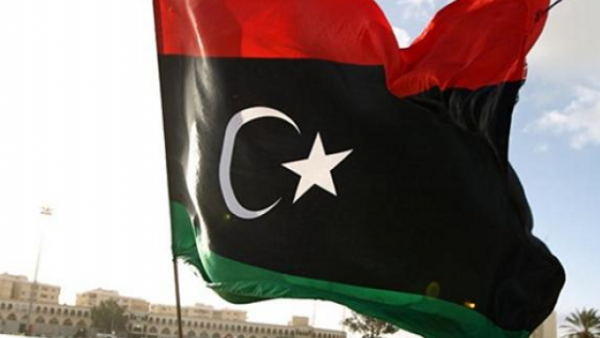 A man waves the Libyan flag. (AFP/File Photo)
