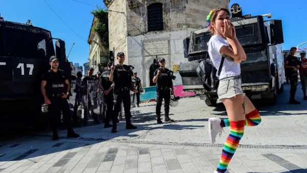 Turkish riot police officers block ways to Istikjlal avenue for LGBT rights activist (C) as they try to gather for a pride parade, which was banned by the governorship, in central Istanbul, on June 25, 2017. (Bulent Kilic/AFP)
