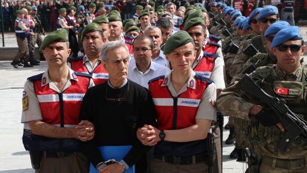 Turkish Gendarmerie escorting defendants Akin Ozturk (2L) and others involved in last July’s attempted coup in Turkey as they leave the prison where they are being held. (AFP) 