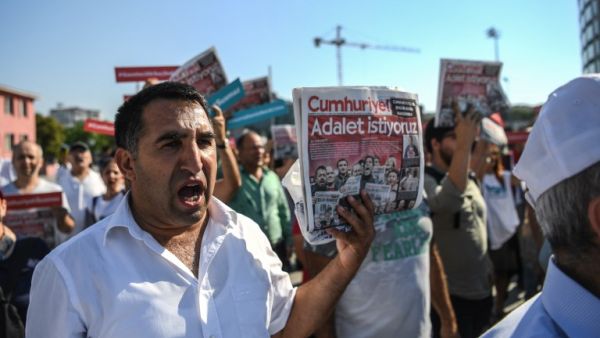 "We Want Justice" reads cover of opposition paper Cumhuriyet daily as protesters march on courthouse (Ozan Kose/AFP)