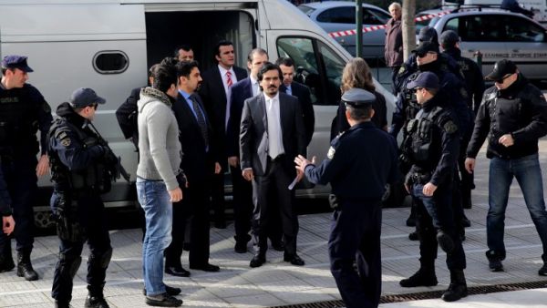 Turkish officers are escorted by Greek special police forces as they arrive at the Greek Supreme Court in Athens, for a hearing concerning a possible extradition of the officers over July's failed coup in Turkey, on January 23, 2017. (AFP/Angelos Tzortzinis)