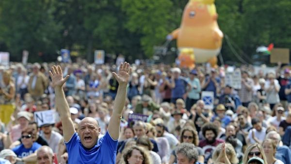 A giant balloon depicting US President Donald Trump as an orange baby is launched as protesters gather in the Meadows, after taking part in the Scotland United Against Trump march through the streets of Edinburgh, Scotland on July 14, 2018, on the third day of US President Donald Trump's four-day UK visit. (AFP/File)