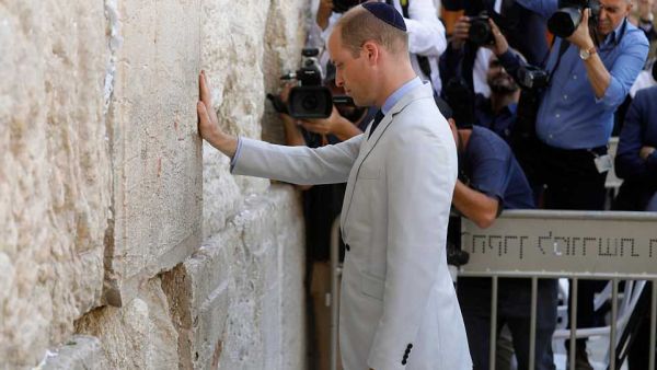 Britain's Prince William touches the Western Wall, the holiest site where Jews can pray, in Jerusalem's Old City today. (AFP/ File) Britain's Prince William touches the Western Wall, the holiest site where Jews can pray, in Jerusalem's Old City today. (AFP/ File)